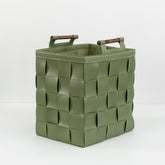 Zola leather storage basket filled with blankets and magazines, styled in a modern living room setting